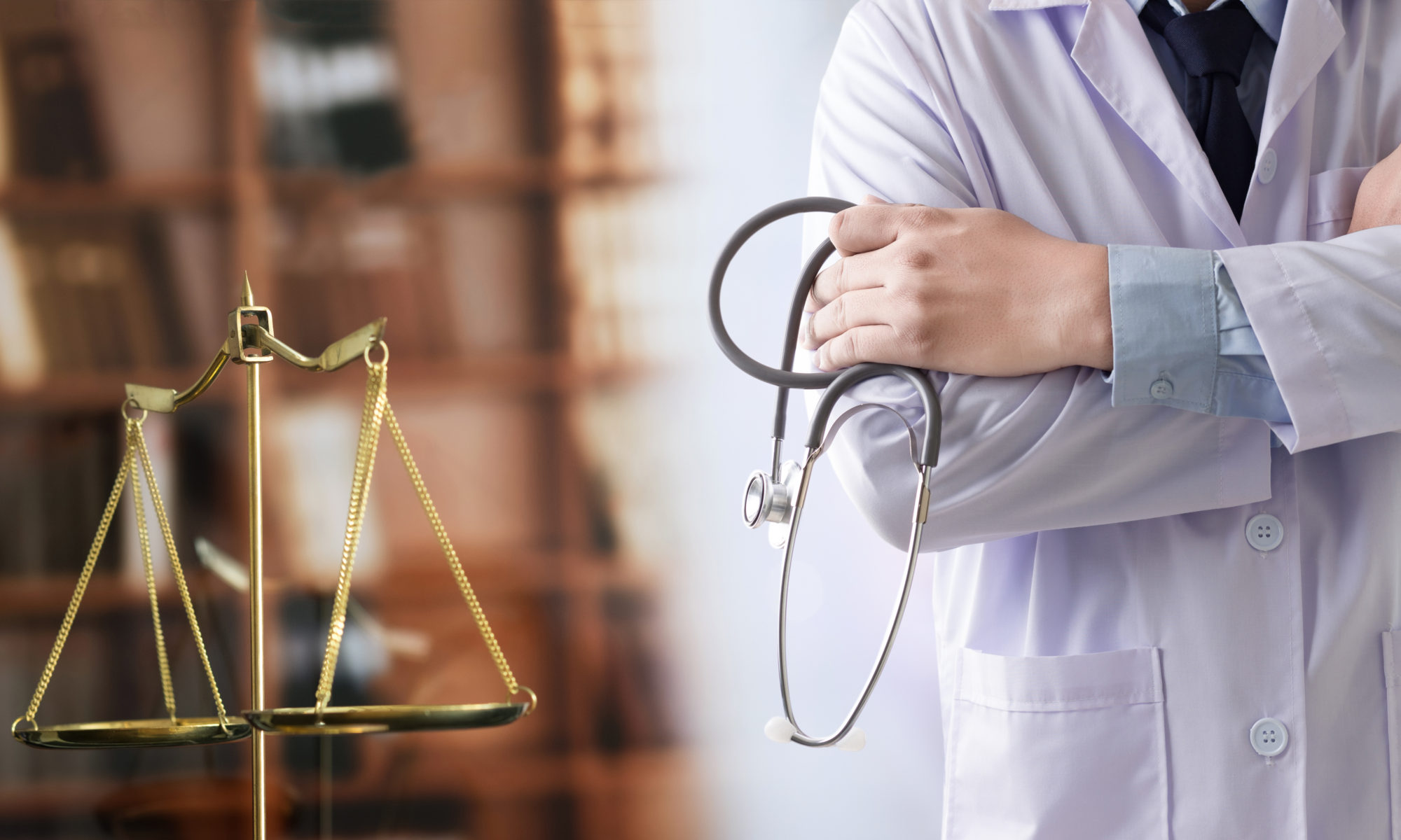 A doctor's arm crosses over a stethoscope, next to a golden scale of justice, symbolizing the intersection of medicine and law.