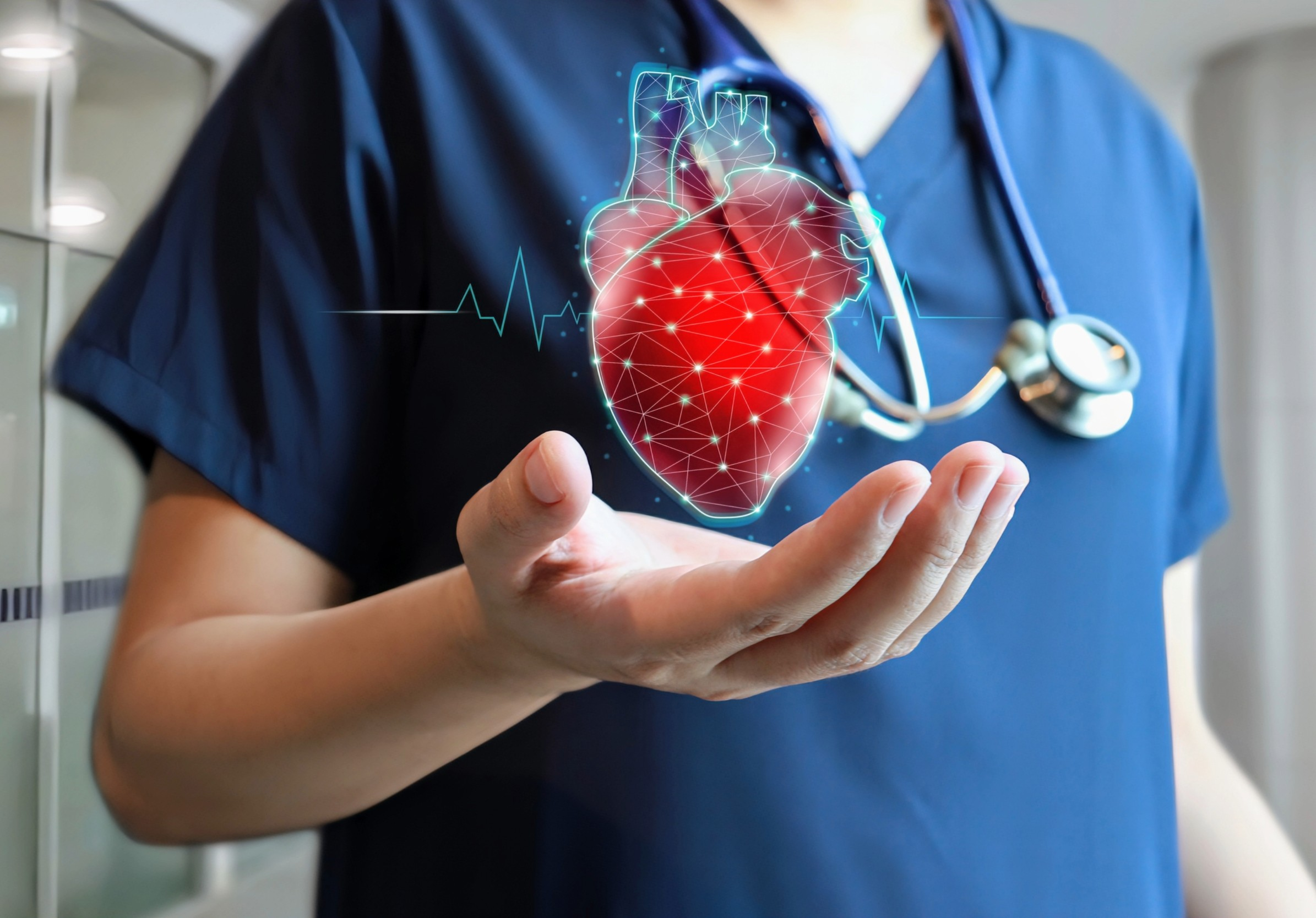 A best cardiologist holds a glowing digital heart, symbolizing health monitoring and cardiac care, with a stethoscope nearby.